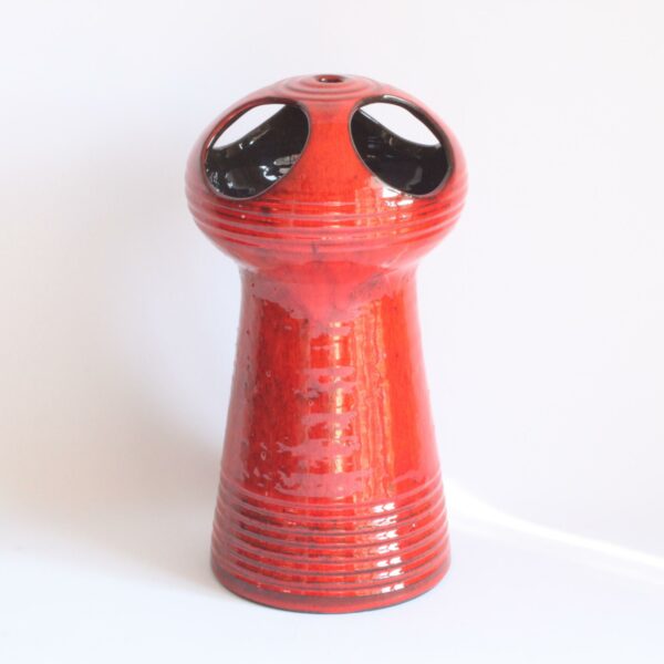 Red glazed space age style ceramic vase. Hand turned ribbed vase, round UFO-like head with four holes cutout. By Emiel Laskaris, Belgium 1960s. Emmanuel "Emiel" Laskaris was a Greek ceramic artist. He settled in Sint Niklaas and was active between the 1960s-1980s. Simultaneous with the Perignem,Amphora and Marechal ateliers. Century soup vintage design antiques curiosa collectibles antwerp.