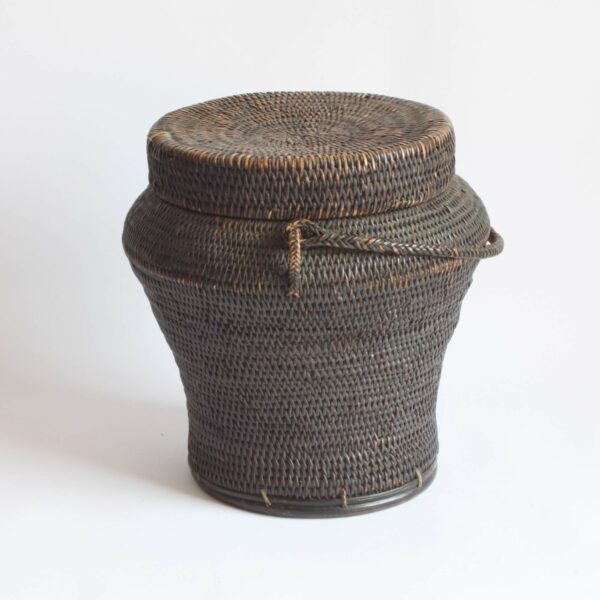 Rattan rice storage basket also called Ulbong. Used in the Ifugao region by the indigenous Peoples of Luzon/The Cordilleras. These jar shaped baskets were modeled after Chinese ceramic jars of similar shapes. The handle was used to hang the baskets and protect it from rodents.