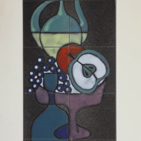 A tall ceramic tile tableau or wall plaque by Capra Italy, 1960s. Depicting an abstract still-life. Modernistic composition of fruits, bottle, teapot, etc... in purple, green, yellow, blue, red and white glazing. On a charcoal black background. Condition report: Excellent vintage condition, may show minimal signs of wear consistent with age and use. Signed on bottom right corner tile: Capra