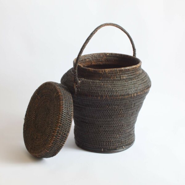 Rattan rice storage basket also called Ulbong. Used in the Ifugao region by the indigenous Peoples of Luzon/The Cordilleras. These jar shaped baskets were modeled after Chinese ceramic jars of similar shapes. The handle was used to hang the baskets and protect it from rodents.
